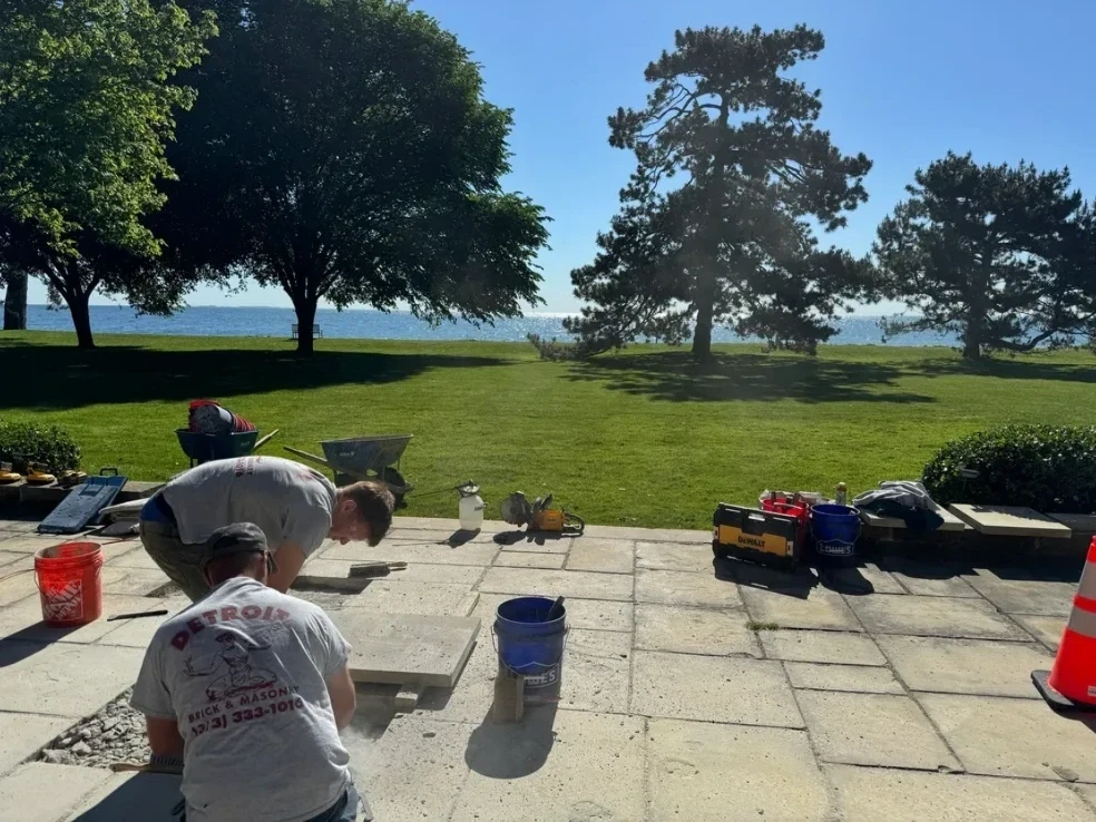 Detroit Brick and Masonry crew working on waterfront flagstone patio