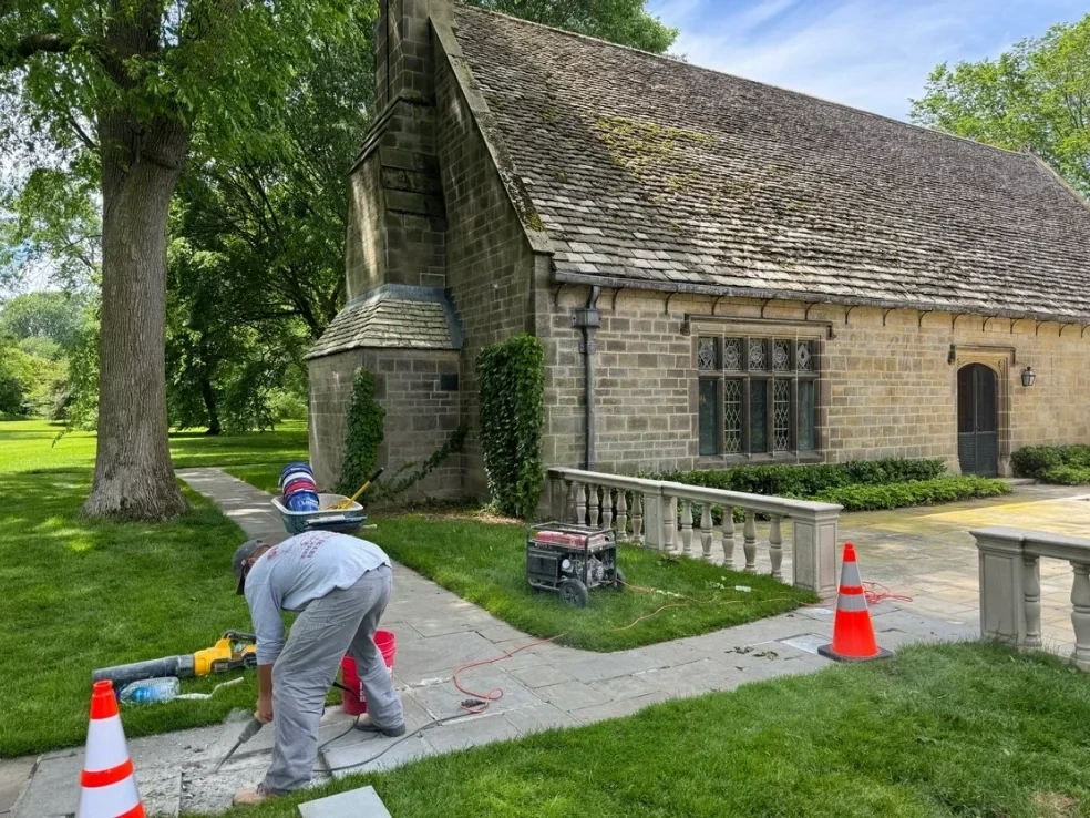Masonry restoration work on historical stone estate building